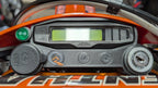 Quinnware dashboard installed on a KTM EXC-F with speedometer, USB outlet, indicator light, and ignition switch